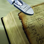 Filmoplast heat set tissue in use on damaged book pages