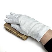 white cotton glove in use with old book